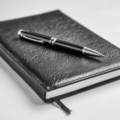 A stylish leather-bound notepad with a black pen diagonally resting on it, placed on a clean white desk.