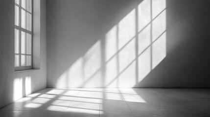 Sunlight streams through a window onto a white room
