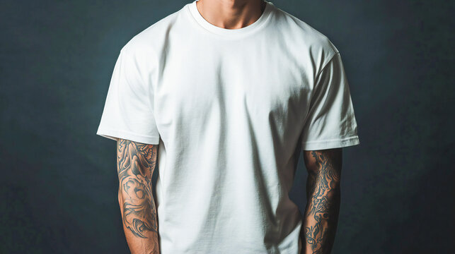 white tshirt mockup, the model is stylish man with arm tatoo, standing wearing white oversized t shirt style, oversize tshirt mock up, front view, no face