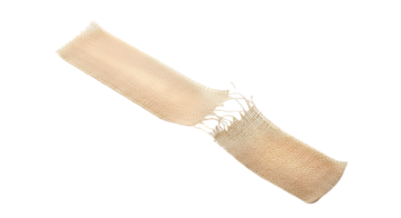 A torn strip of beige medical tape with a gauze-like texture, placed diagonally on a clean white background