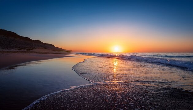 sunset hues grace the serene bushehr coast as gentle waves ripple across calm ocean waters under a gradient sky