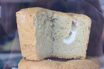 Delicious cornbread loaf showing soft inside with cream cheese filling