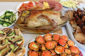 barbecue, roast duck and various light appetizers with vegetables