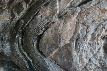 Bent rock on folds layers of limestone. Curves in limestone  cause by under heat and pressure beneath the Earth's crust.