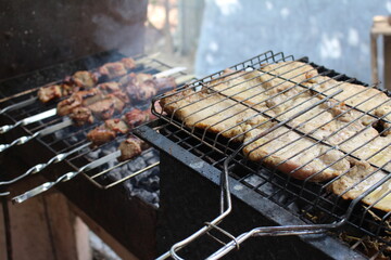 cooking barbecue outdoors on a grill