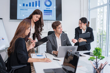 Group of Asian businesspeople are having a meeting.