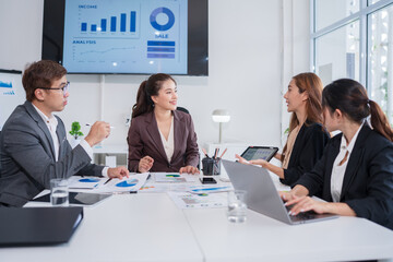 Group of Asian business people meeting and presenting work in the office