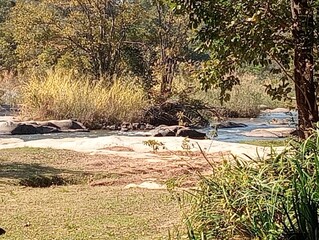 river running through hazyview cabanas