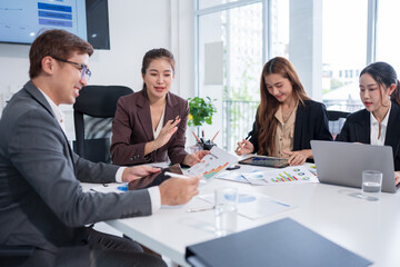 Group of Asian business people meeting and presenting work in the office