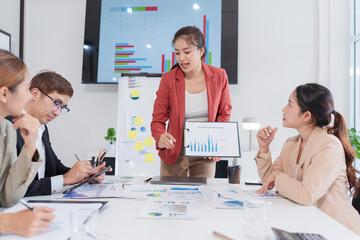 Group of Asian business people meeting and presenting work in the office
