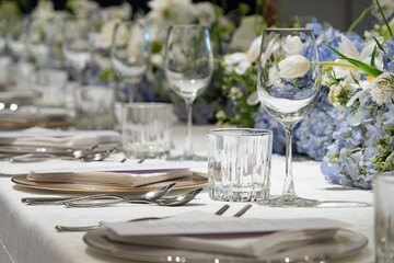 wedding reception dinner table suit set up with decoration flower before evening event start