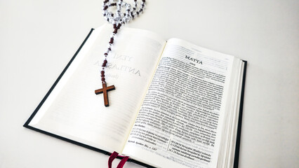 Wooden Rosary Cross on Turkish Written Christian Bible