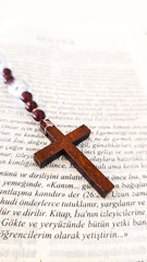 Wooden Rosary Cross on Turkish Written Christian Bible