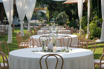 wedding reception dinner table suit at the garden in sunshine before event start