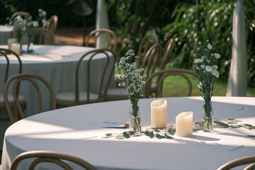 wedding reception dinner table suit at the garden in sunshine before event start