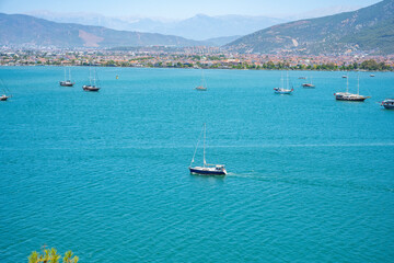 Fototapeta premium Blue Lagoon and Oludeniz beach aerial panoramic view. Oludeniz is a beach resort in the Fethiye district of Mugla Province, Turkey.
