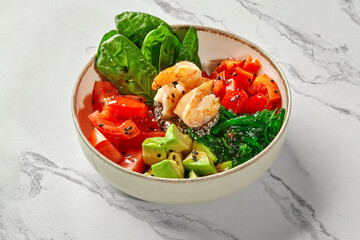 Healthy colorful hawaiian dish served in a bowl on a marble table
