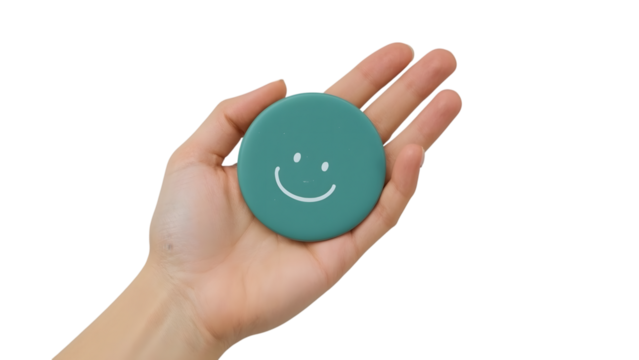 Simple joy captured as a smiling face token rests gently in an open palm