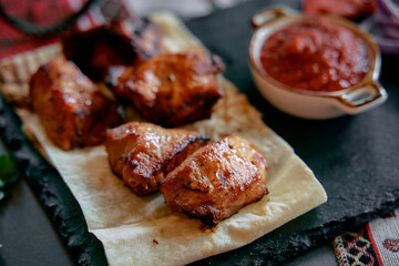 Savory Grilled Chicken Thighs Served with Rich Tomato Salsa on a Rustic Platter for a Flavorful Culinary Experience
