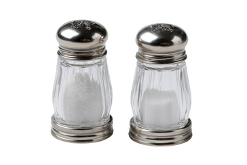 Two clear glass salt shakers, filled with white salt crystals, sit side-by-side on a plain background.  Each shaker has a tapered shape, and a metal, light gray, cap