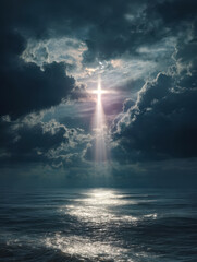 Obraz premium Sunlight breaking through dark clouds over a calm ocean scene