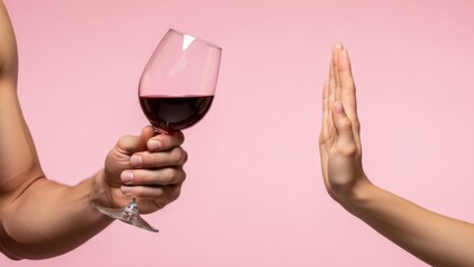Woman refusing glass of red wine, refusing hand gesture offered by shirtless man pink backdrop. No means say no to alcohol, abstinence, Dry January, Sober October, stop drinking, personal boundaries