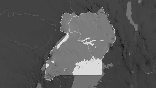 Uganda on the map. Zoom and highlight of the area on a grayscale map