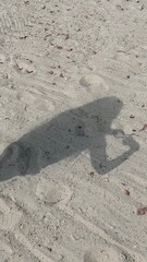 Shadow on sand beach surface
