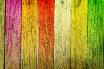 Many color on wooden plank background.