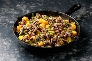 Loaded Tater tots Potatoes with beef and cheese. Fast food.