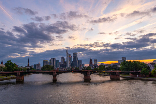 Illuminated Frankfurt City Downtown, Ignatz Bubis Bridge and Main River at Summer Sunset. Hesse, Germany