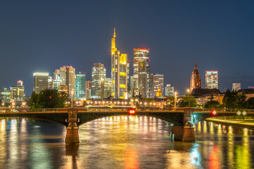 Fototapeta premium Illuminated Frankfurt City Downtown and Main River at Night. View from Floserbrucke Bridge. Hesse, Germany