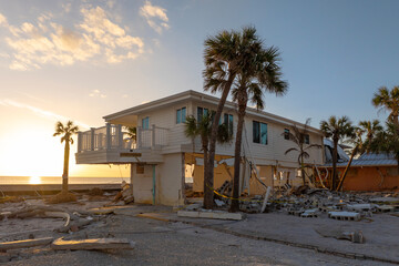 Natural disaster and its consequences. Hurricane destroyed houses roof and walls in Florida coastal area