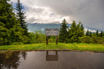 Road trip travel in Appalachian mountains at sunset. Mt. Mitchell Overlook on parkway and woods nature in summer season. Colorful forest in North Carolina