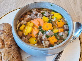 Hearty Beef and Noodle Soup with Carrots and Chives