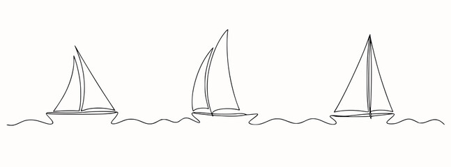 Three sailboats gliding on wavy water sailing ocean
