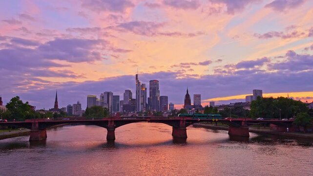 Frankfurt City Downtown, Tram on Ignatz Bubis Bridge and Main River at Summer Sunset. Hesse, Germany