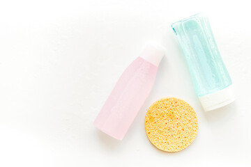 mycelial water , lotion and sponge for skin care on white background flat lay space for text