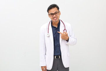 Asian male doctor wearing doctor's coat, stethoscope hanging around neck, surprised and ambushed,...