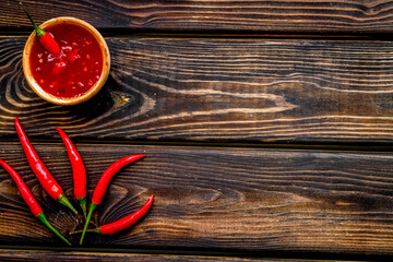 hot chilli pepper pattern on wooden background top view mock up