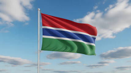 Vibrant Gambian flag waves proudly against a clear blue sky with fluffy clouds, symbolizing national pride and freedom.