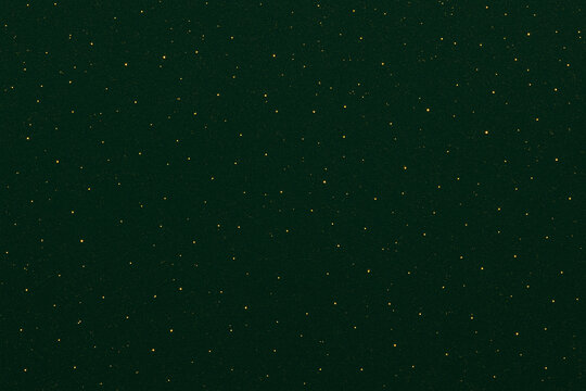 A rich, dark forest green background sprinkled with delicate golden sparkles, creating an elegant and festive visual effect. The subtle shimmer evokes a luxurious holiday ambiance - Powered by Adobe