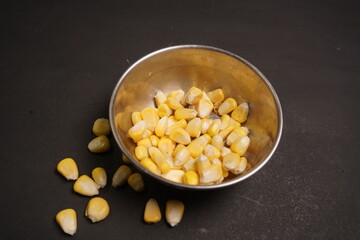 Sweet Corn : Corn kernels are small maize fruits containing a hard shell, dense starch-filled endosperm, and embryo germ essential for growth