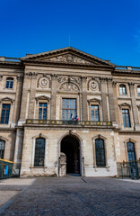 Stunning architecture of the Louvre Museum, showcasing its classic design and a symbol of French pride
