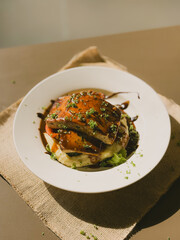 chicken breast with smashed potato and veggies