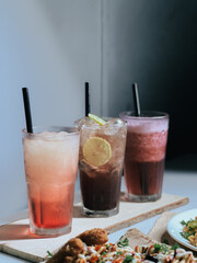 glasses of differt flavour of  lemonade