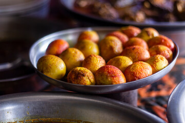 Many yellow eggs in a pot on the table