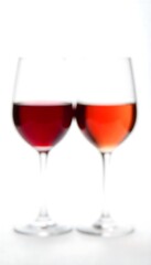 Generative AI: Two Glasses of Wine, Offering a Blurred Visual of Deep Reds and Light Oranges on