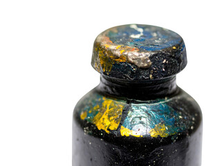 A close-up of a paint bottle featuring a textured cap with vibrant colors and speckles, showcasing...
