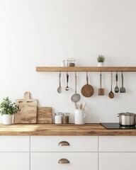 Modern kitchen, light-colored cabinets and wood countertop, utensils hanging